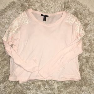 Long sleeve shirt with lace design on the sleeve